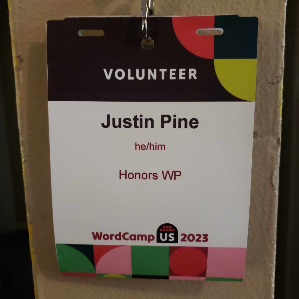 Justin Pine's volunteer badge at his first WordCamp event.